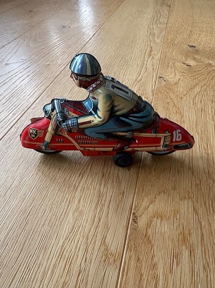 Uppdragbar plåtleksak motorcykel antik