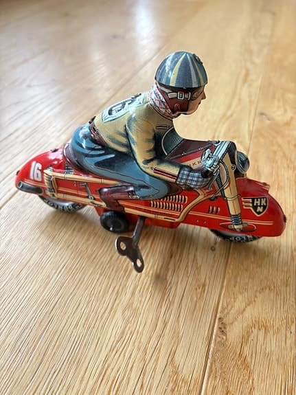 Uppdragbar plåtleksak motorcykel antik