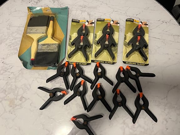 Målarpenslar och fjäderklämmor verktygspaket