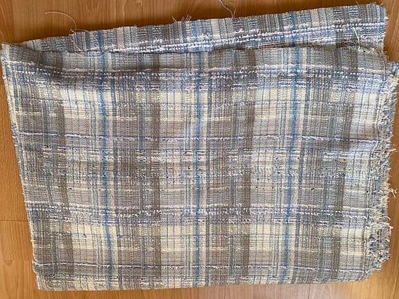 Tweed/Boucletyg med silvergarn