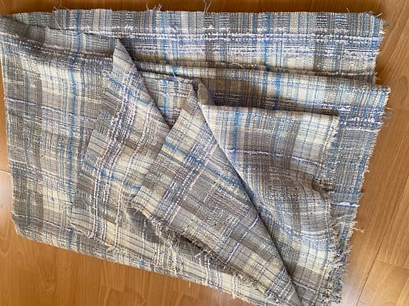 Tweed/Boucletyg med silvergarn