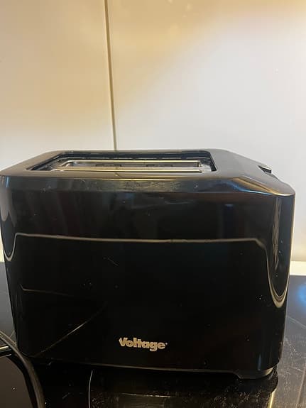 Snygg och smidig brödrost i pianosvart finish