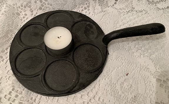 Ljusstake i form av en plättlagg