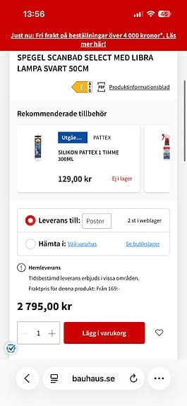 Badrumsspegel med svart ram och belysning