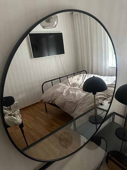 Mio rund spegel med svart ram