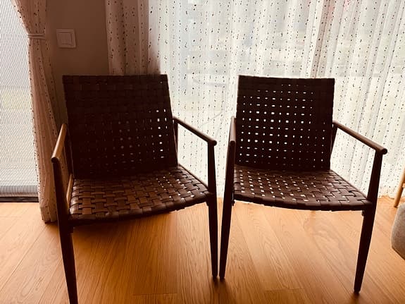 A pair of Mio armchairs