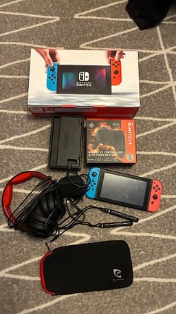Nintendo Switch spelkonsol neon röd/blå med hörlurar och handkontroll