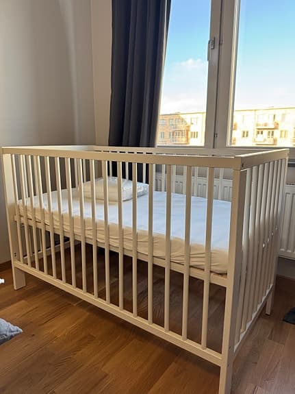 Unused Baby Crib with Mattress and Sheets