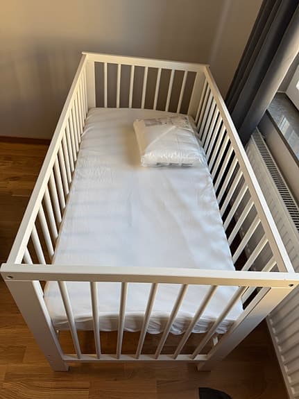Unused Baby Crib with Mattress and Sheets