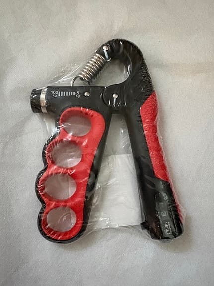 Handtränare justerbar 5–100 kg svart/röd