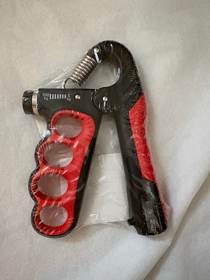 Handtränare justerbar 5–100 kg svart/röd