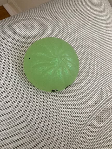 Grön squishy leksak med ansikte