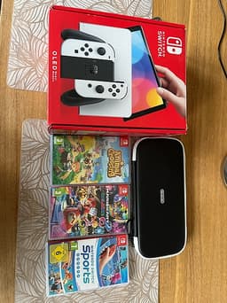 Nintendo Switch oled original kartong med spel och fodral.