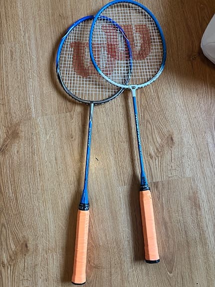 Badmintonracket. 1 st. Wilson racket Strike.  1st Wilson reaktion 70.