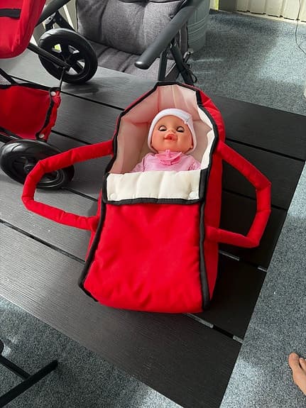 Leksaksbarnvagn med docka