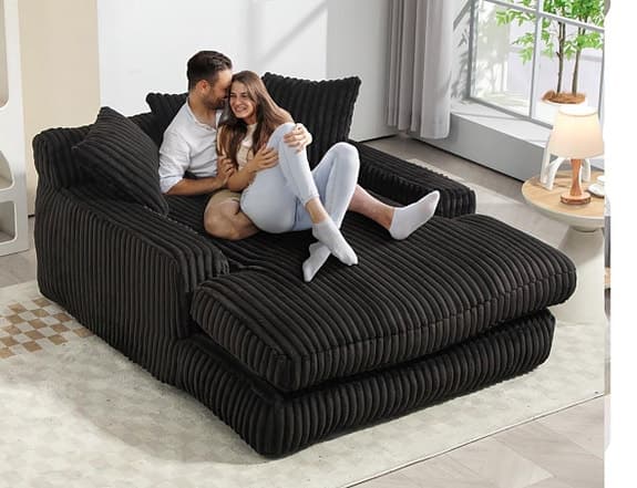 Modern loungesoffa i svart manchester med 3 mjuka kuddar för vardagsrummet.