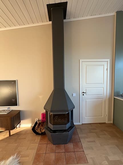 Grå braskamin märke Handöl