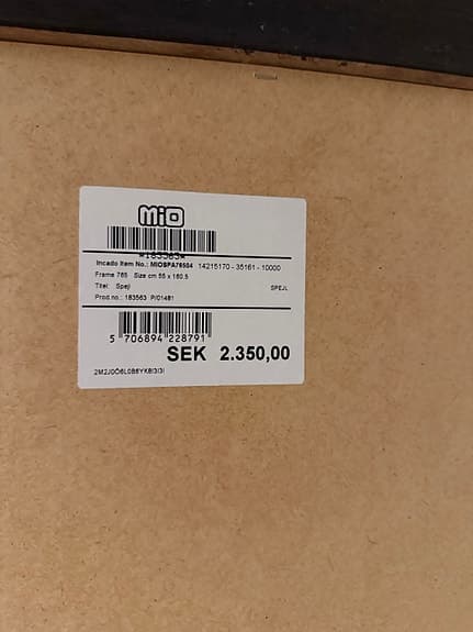 Mio spegel med mörk träram