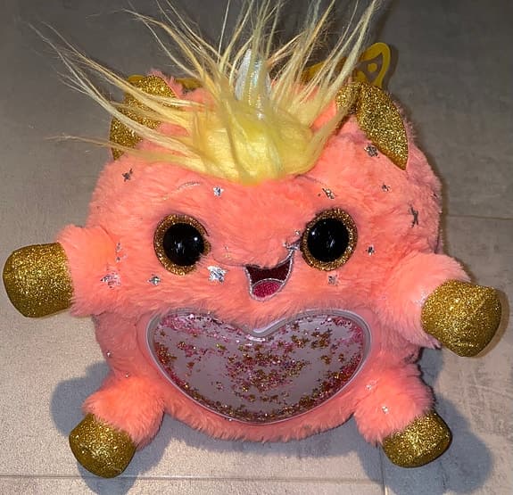 Söt fluffig figur med glittriga detaljer