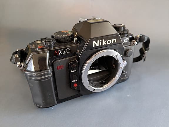 NIKON N2020(usa)/F501(eu) + 50mm 1.8 AF-Nikkor + MF-19 databack.