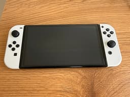 Nintendo Switch OLED + 2 spel och fodral