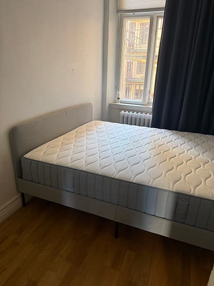 Selling an IKEA upholstered bed (160×200 cm) including mattress.