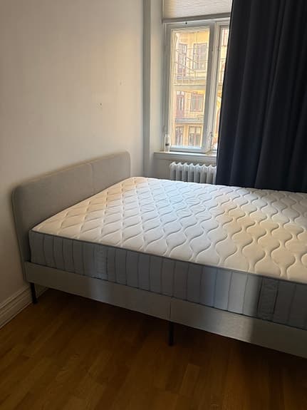 Selling an IKEA upholstered bed (160×200 cm) including mattress.