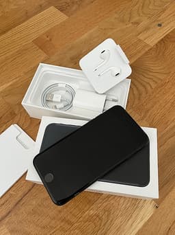 iPhone 7 med oanvända tillbehör