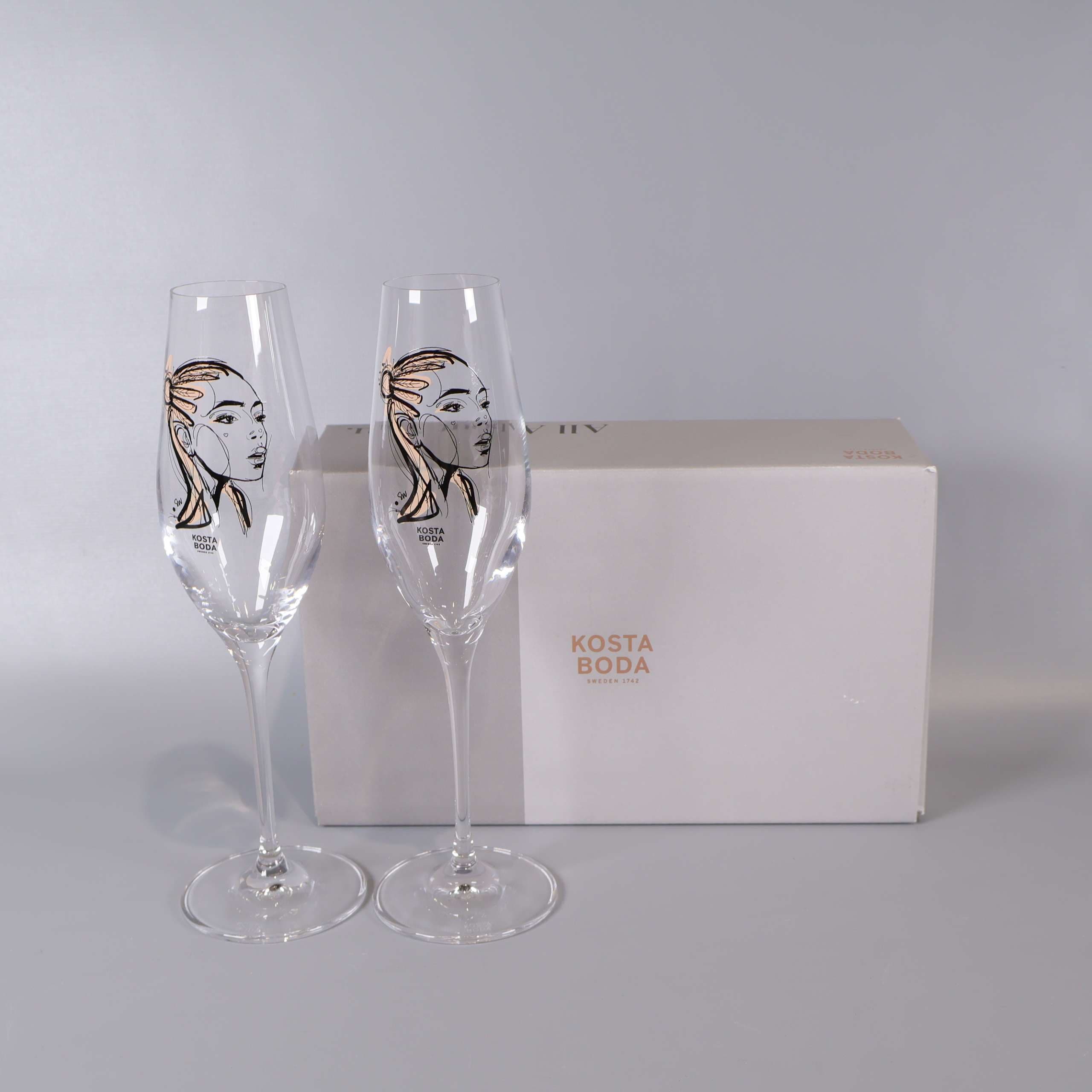 Kosta Boda - Sun Kiss - Sara Woodrow - Champagneglas med konstmotiv