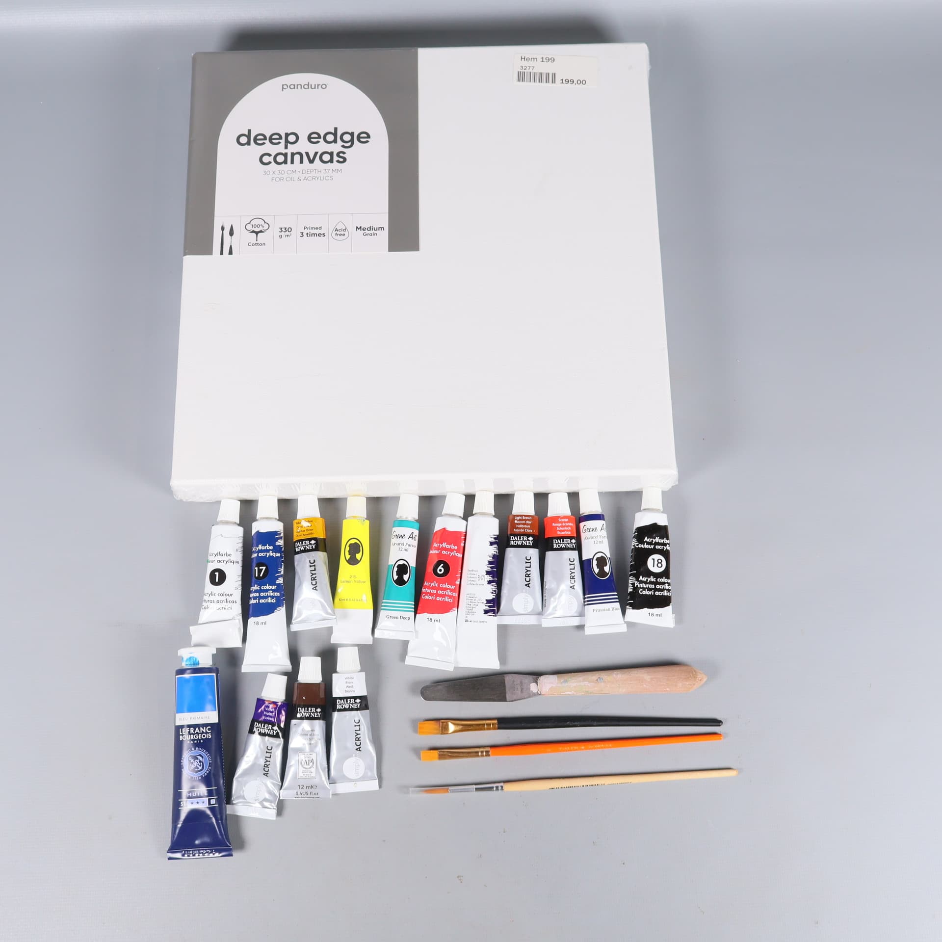 Paket med akrylfärg, penslar, palettkniv och canvas