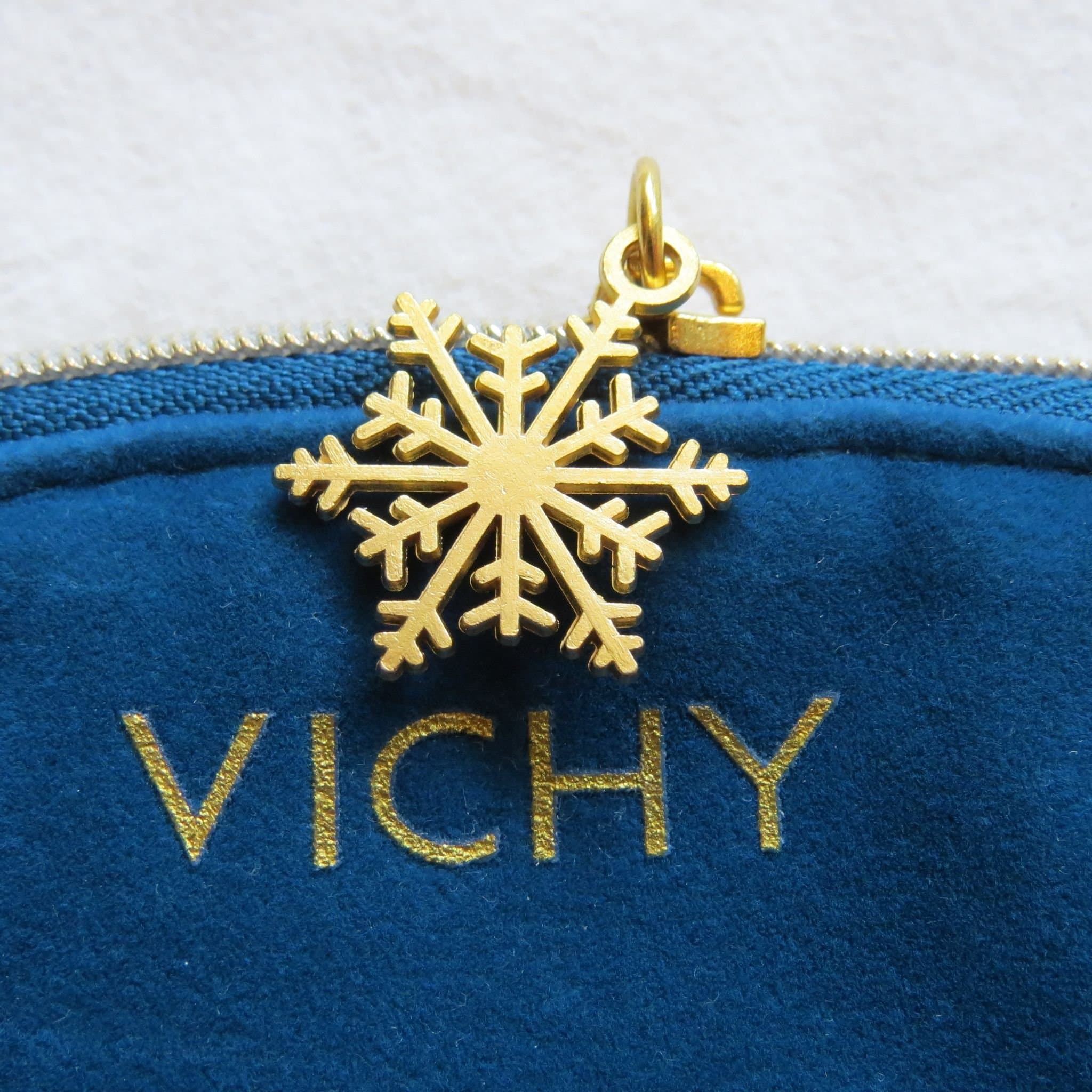 Blå Vichy necessär med snöflinga