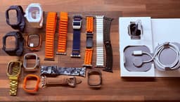 Apple Watch Ultra med många klockarmband.