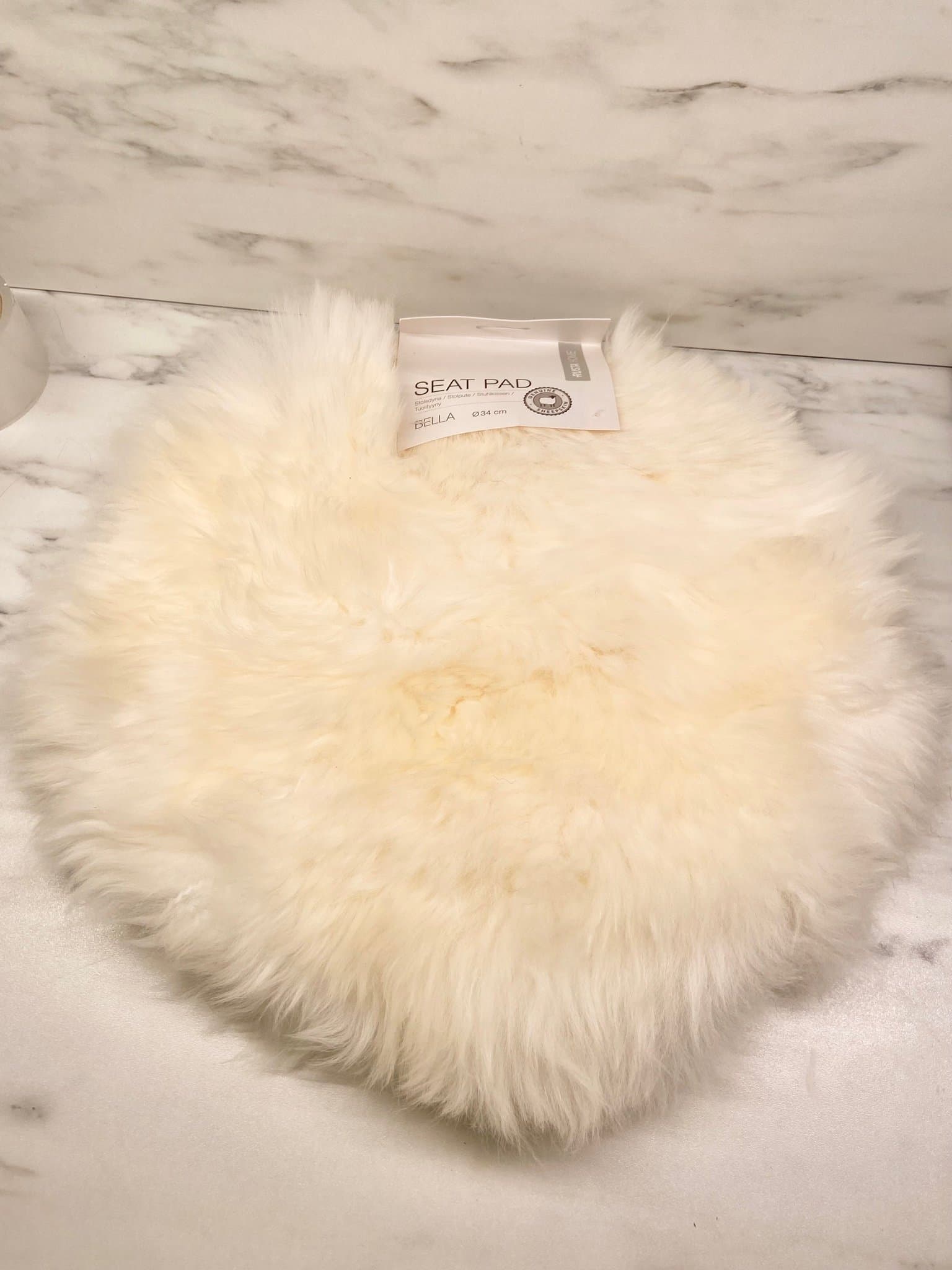 Rund fårskinnsfäll/Sittdyna Bella 34 cm Fårskinn Krämvit