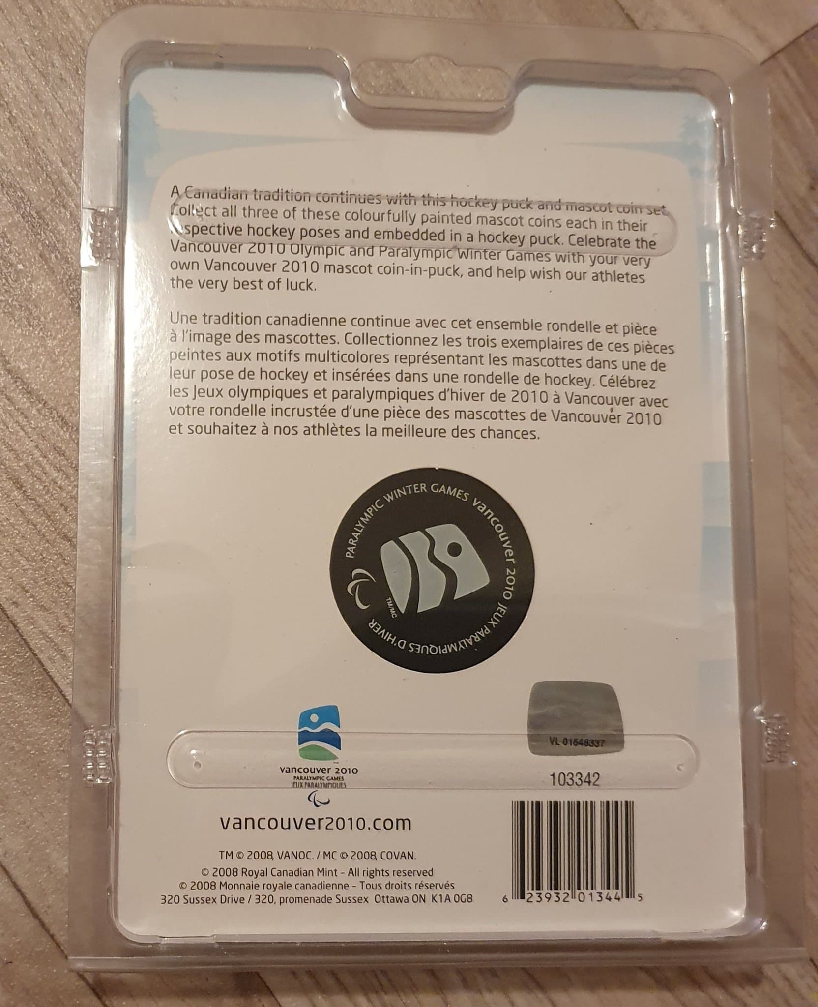 Ishockey Puck Olympic Games 2010 med Maskottchen