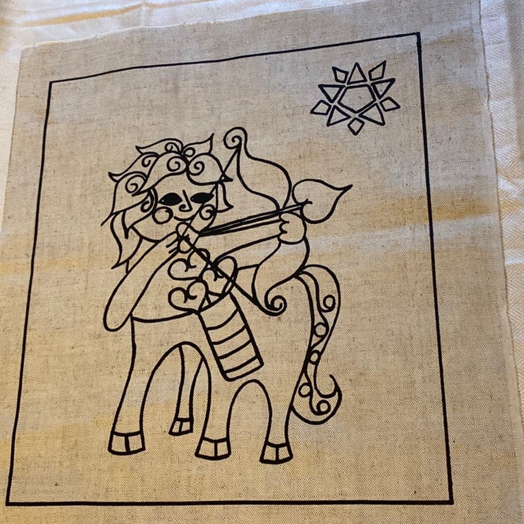 Amor med pilbåge, broderimönster på linneväv