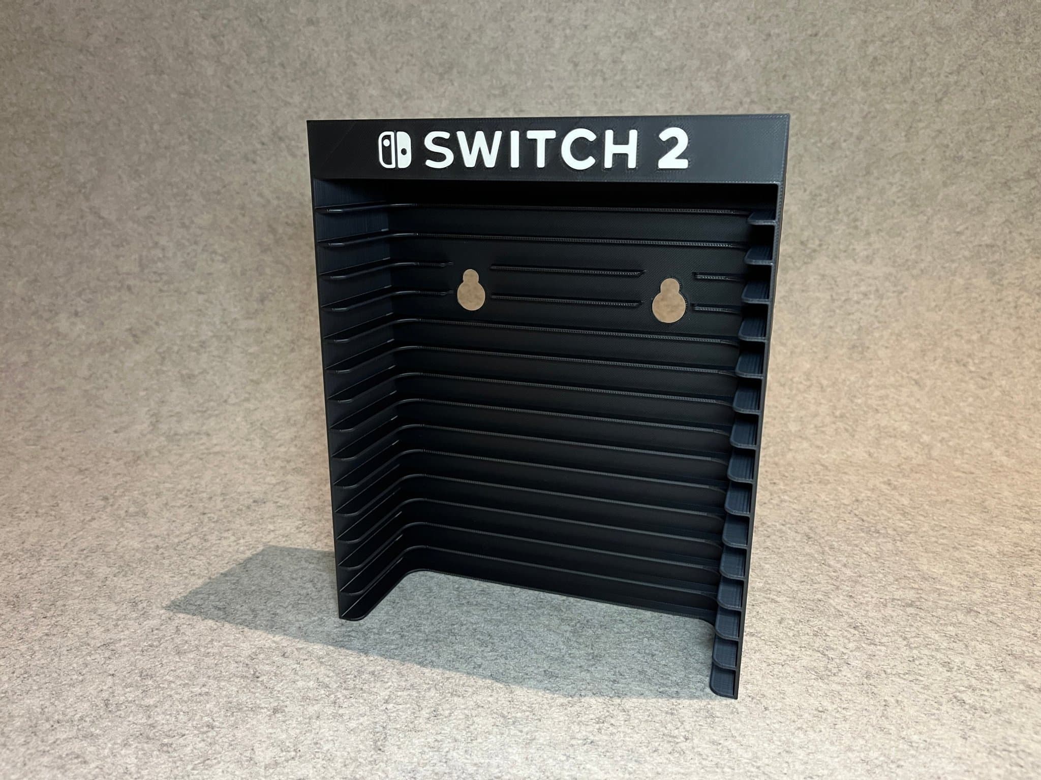 Vägghållare / spelställ för 12 spel till Nintendo Switch 2