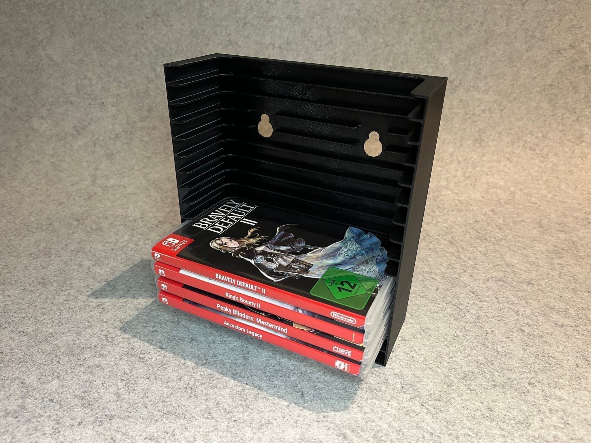 Vägghållare / spelställ för 12 spel till Nintendo Switch