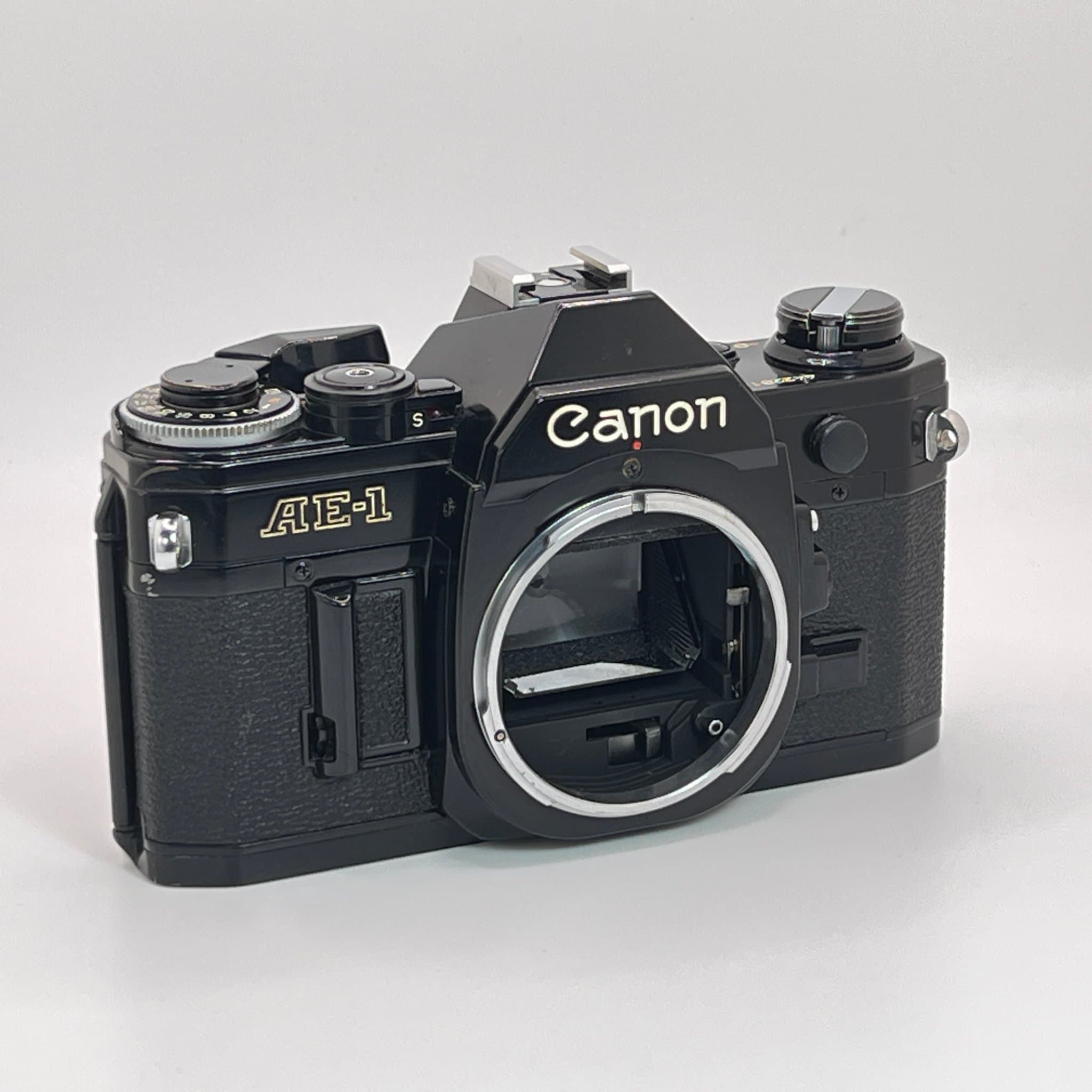 Svart Canon AE-1 kamerahus – Fullt fungerande