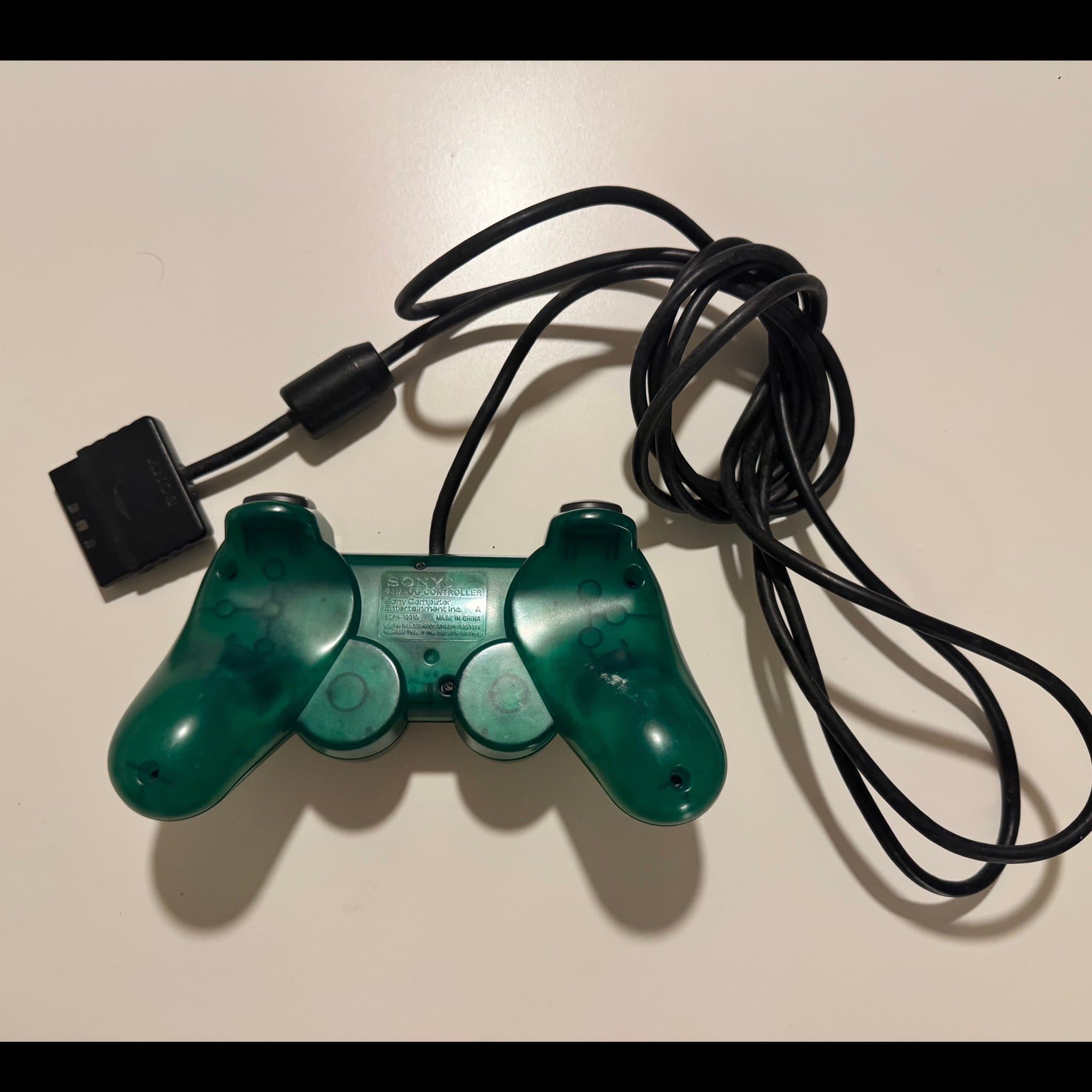 Sony PlayStation handkontroll transparent emerald grön