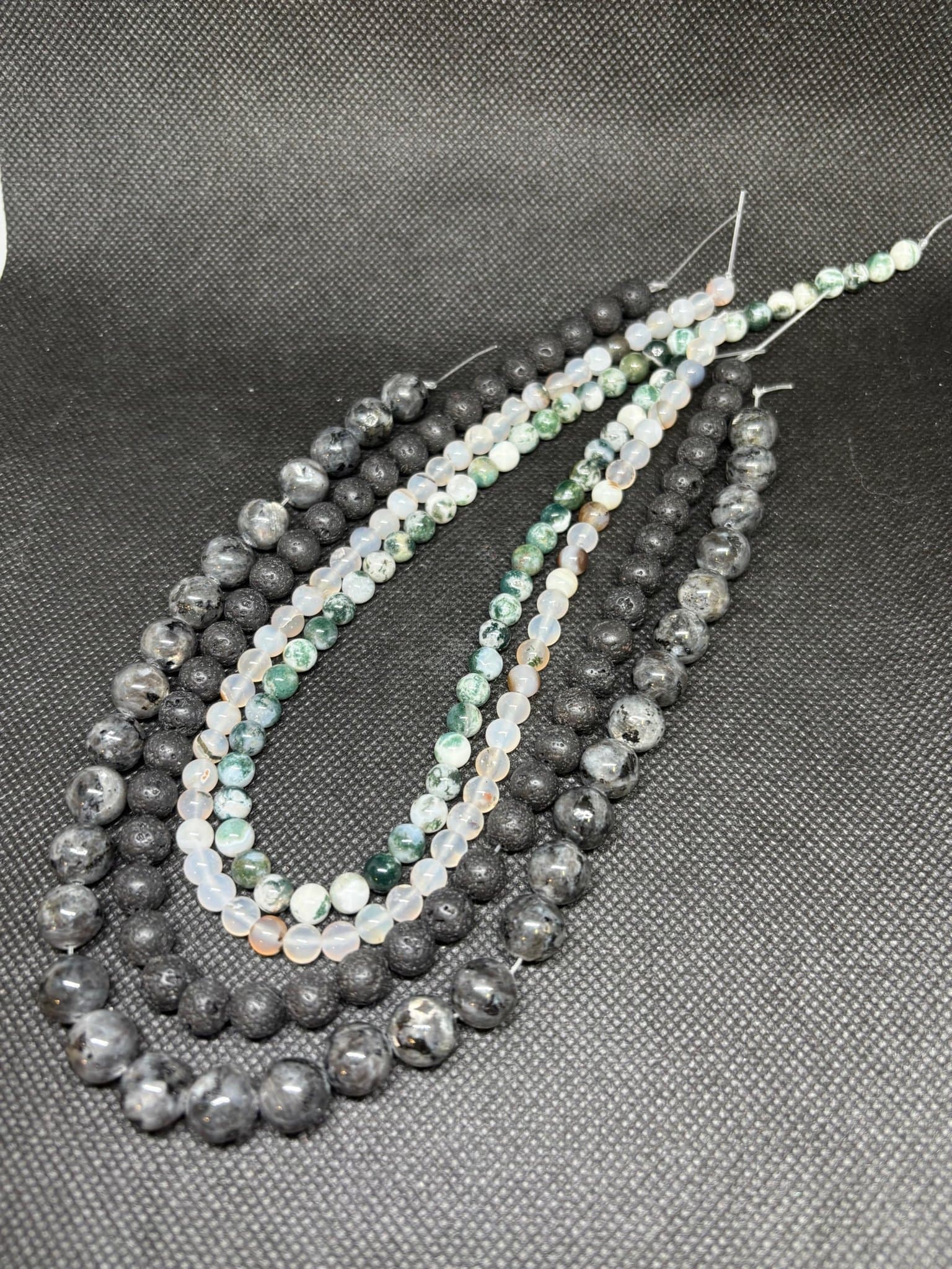 4 pärlsträngar agat vulkan larvikit