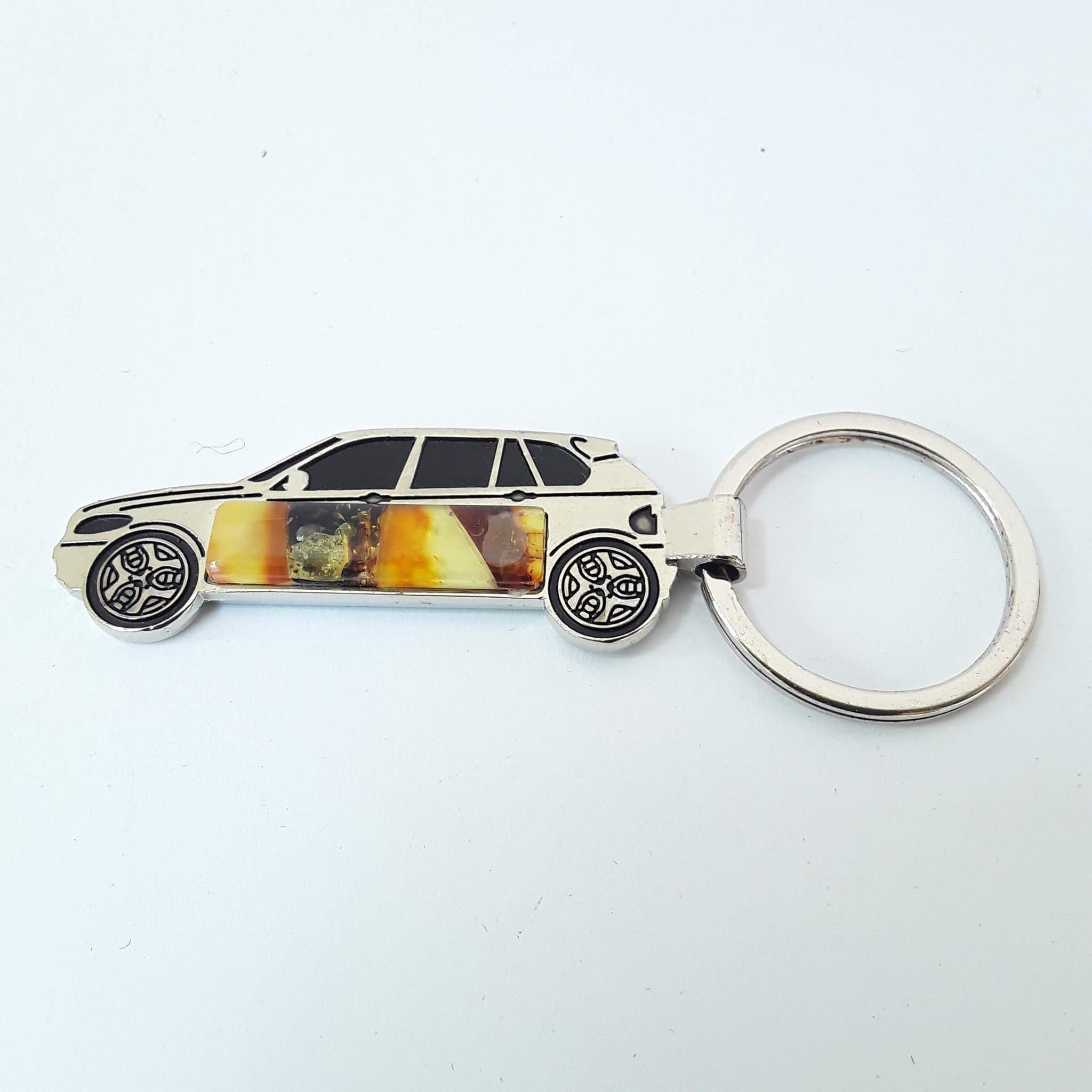 Bärnstensnyckelring i baltisk bärnsten Bilnyckelring i rostfritt stål och ädelstenar med bärnstensmosaik