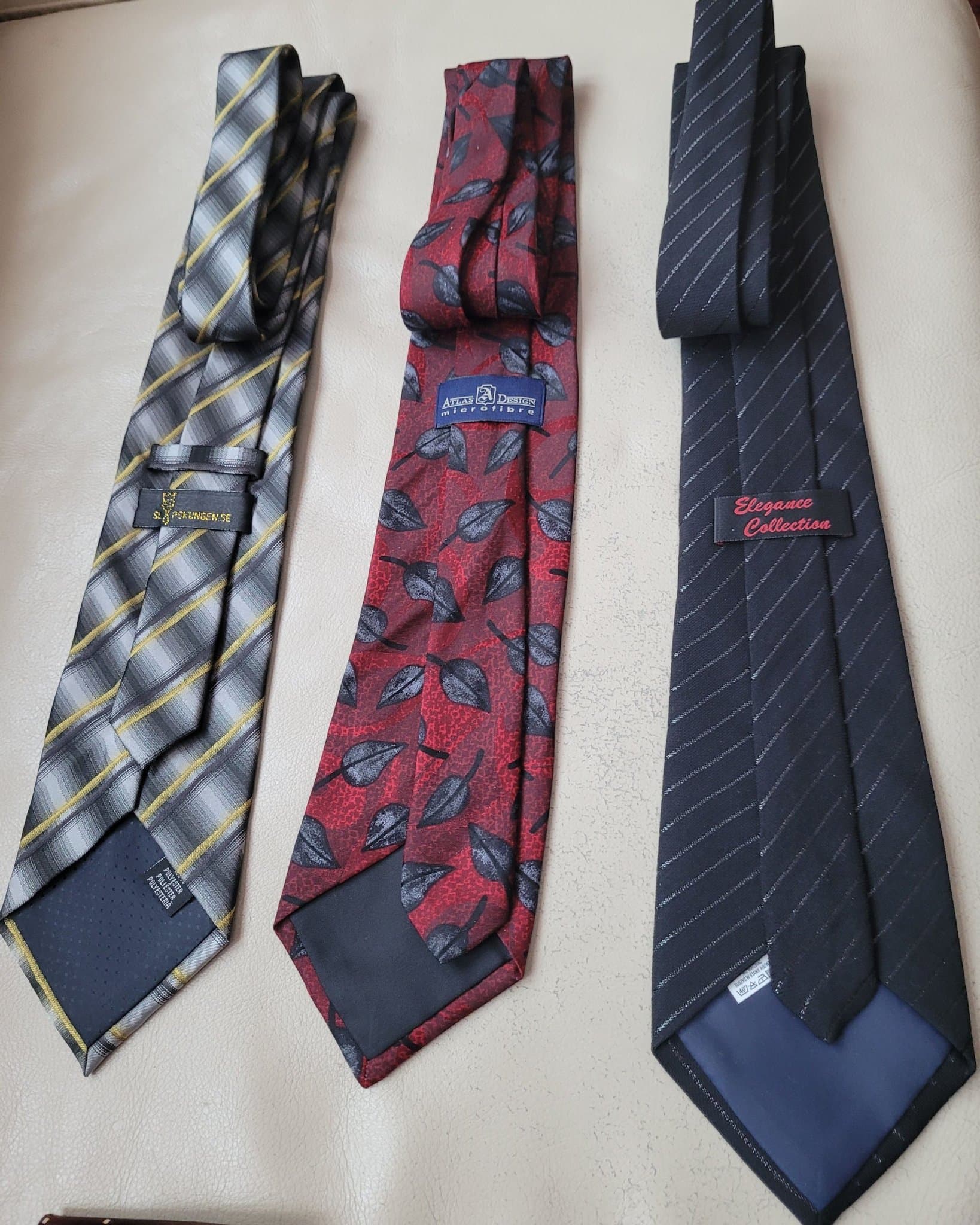 Tre slipsar i olika mönster
