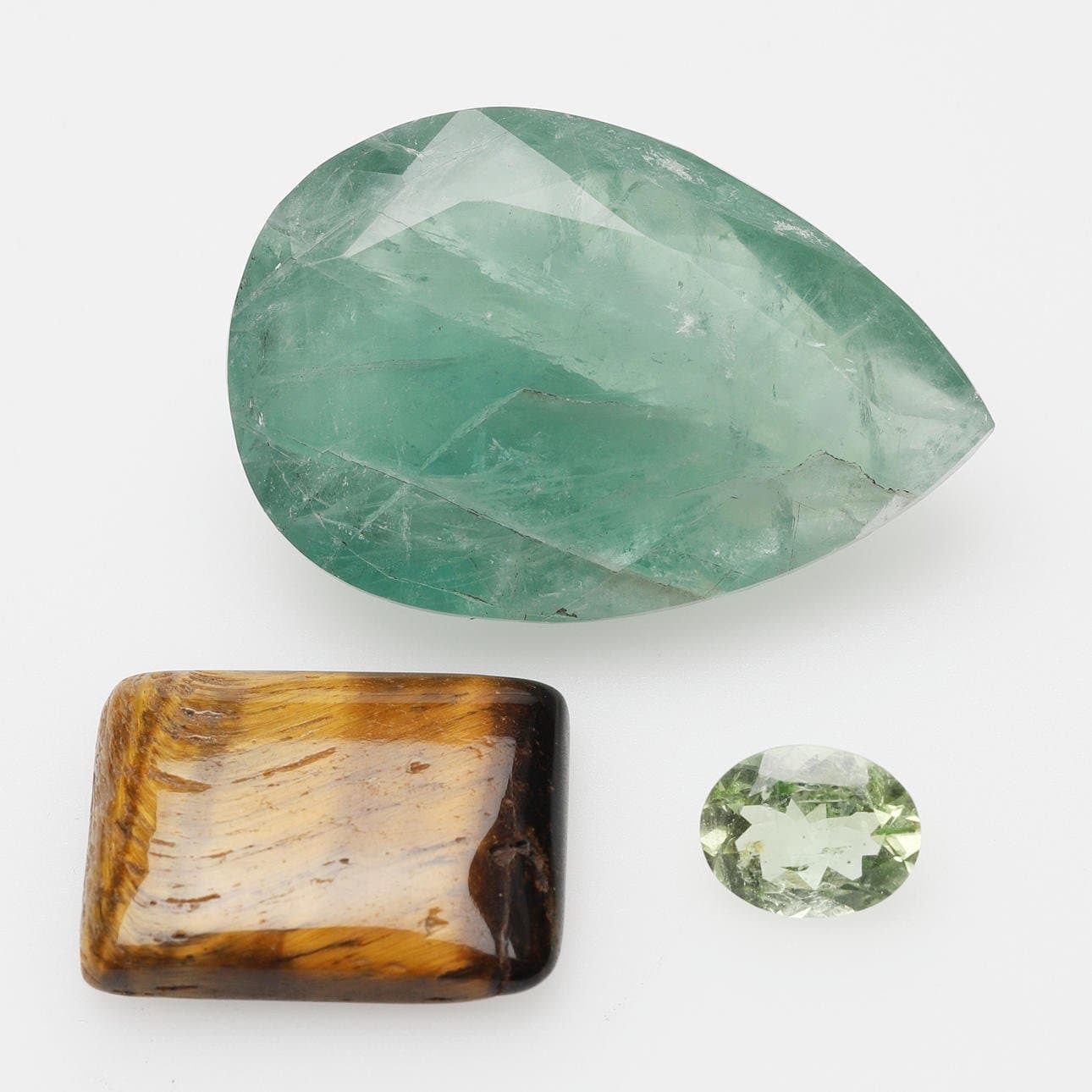 Helidor 1.98 Ct tigeröga 19,05 Ct Fluorit 74,35 Ct