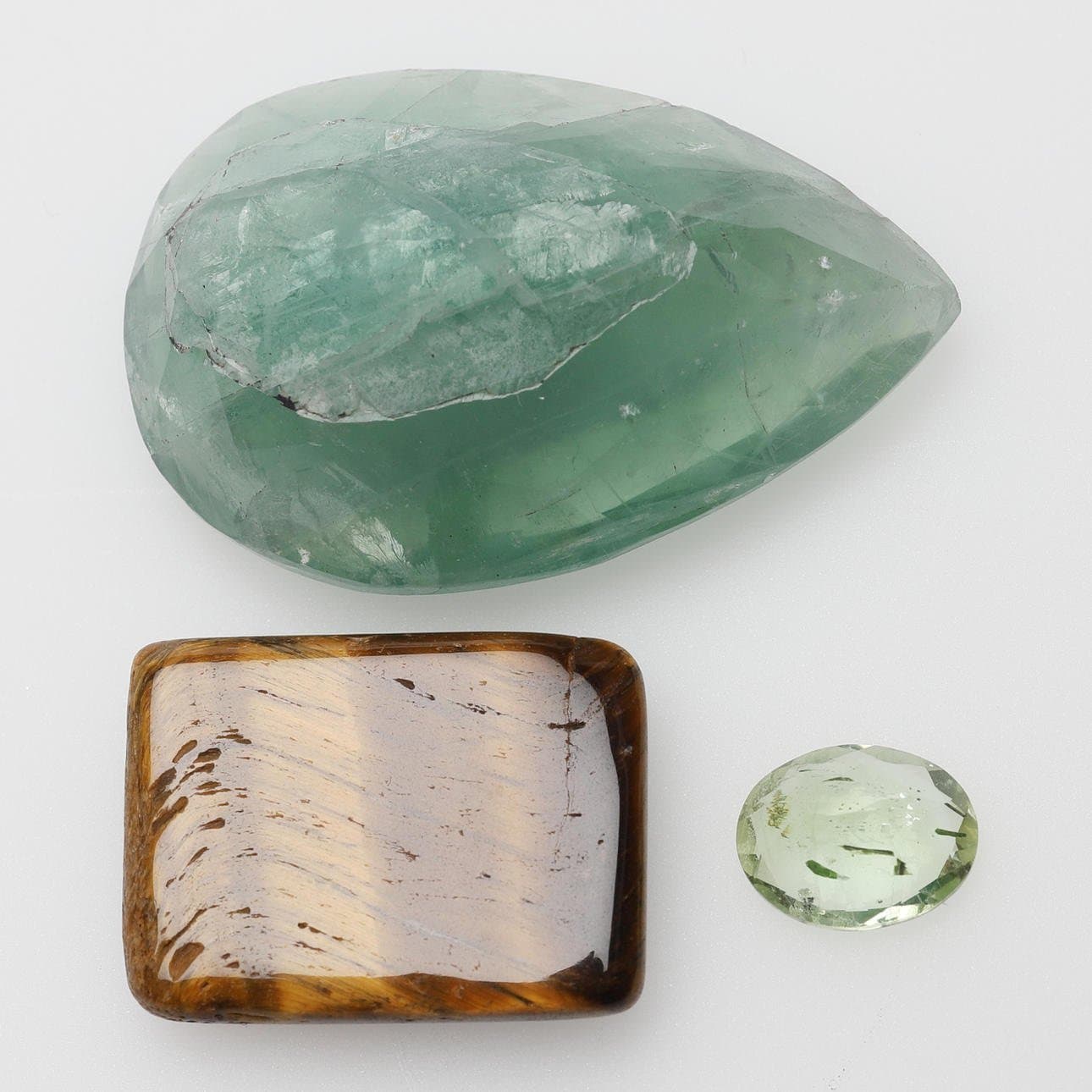 Helidor 1.98 Ct tigeröga 19,05 Ct Fluorit 74,35 Ct