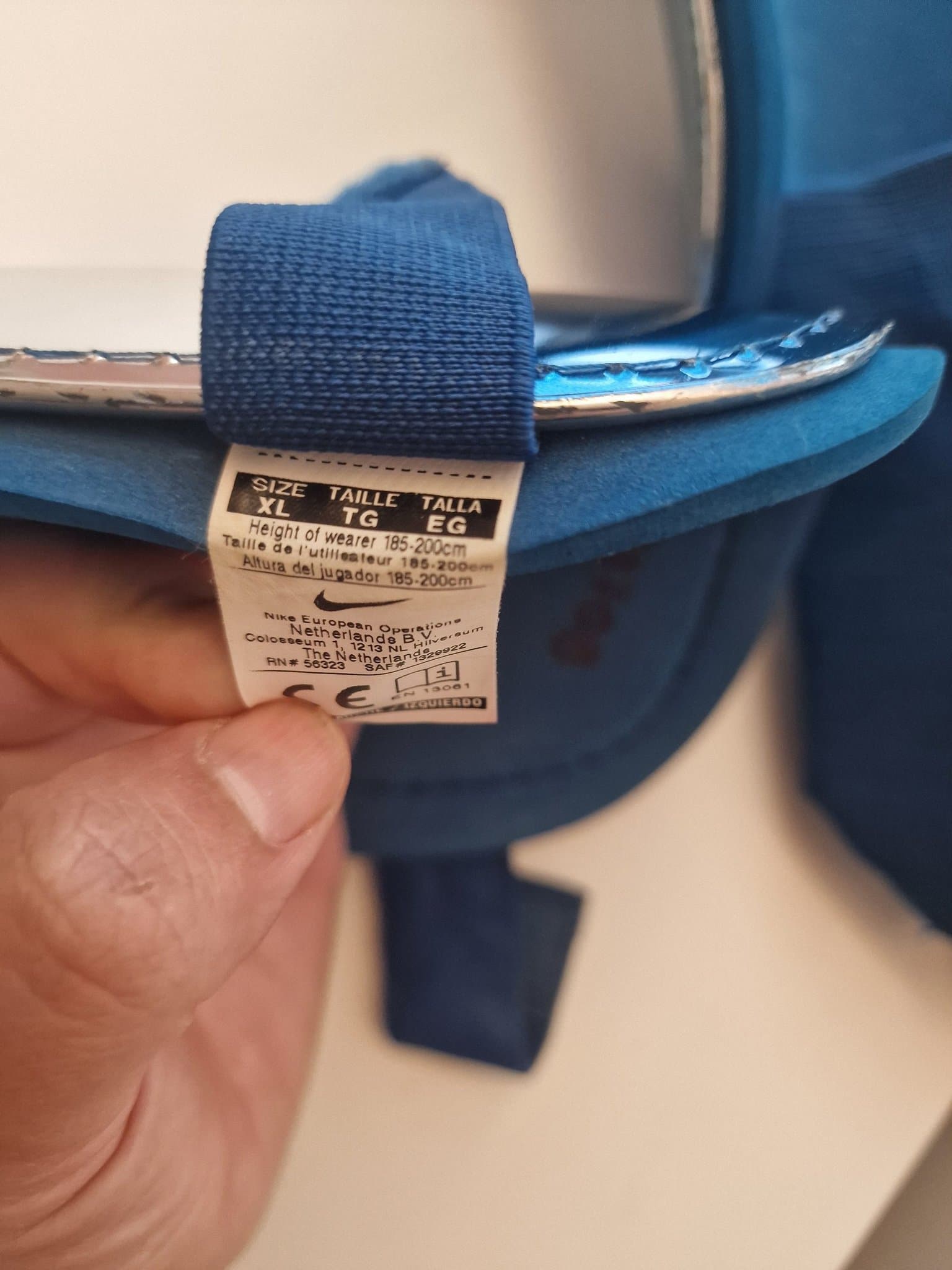 Nike benskydd i storlek TG/EG