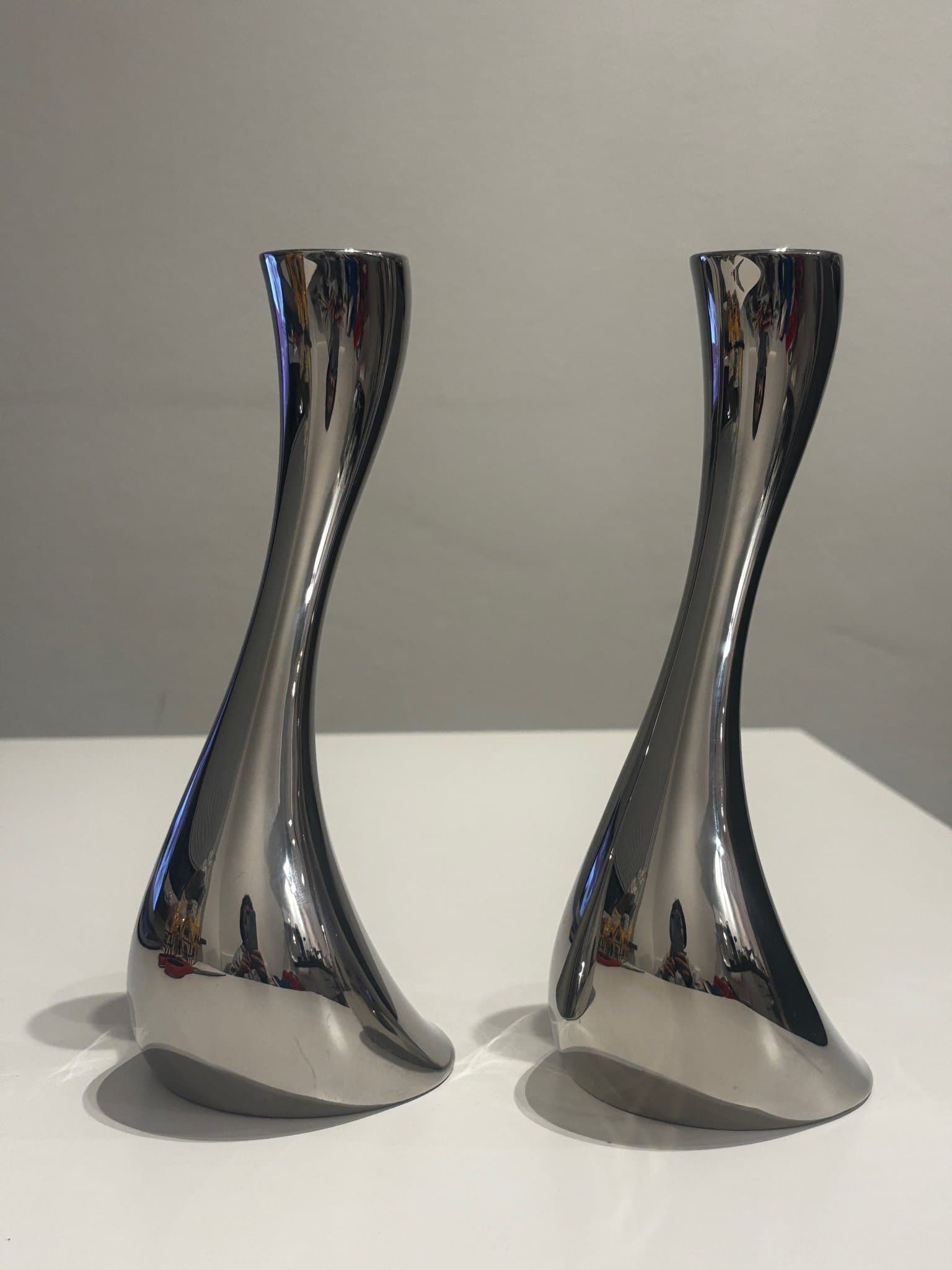 CONSTANTIN WORTMANN. A pair of 2 “Cobra” candlesticks, Georg Jensen, Denmark.